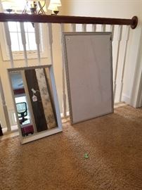 Tray mirror  and dry erase board. 
