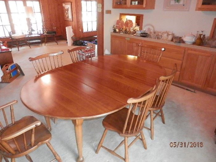 Leopold Stickley SOLID Cherry wood table with pads. Leopold Stickley SOLID Cherry wood chairs...2 arm chairs and 4 side chairs...Label "1956"