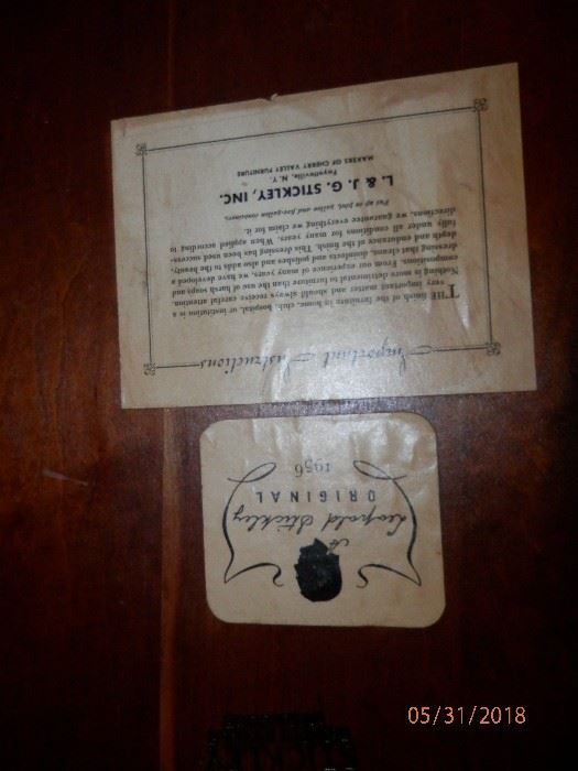 Photo of Stickley  label which appears on Cherry dining table and each chair...1956