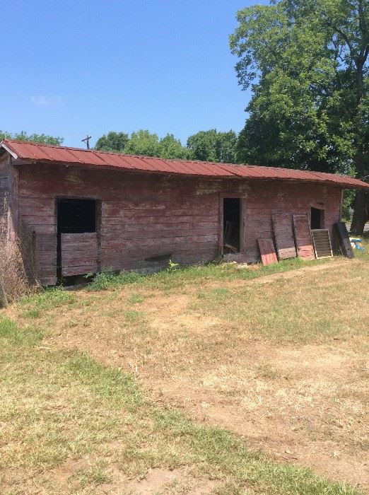 Old feed and hay barn, doors will be sold and the barn wood siding is for sale.