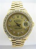 Lady's 18K gold Rolex with diamond dial and bezel