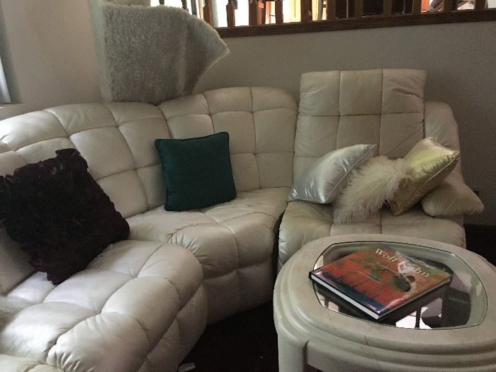 More pillows, shag area rug, painted  glass top end table, and the other end of the ginormous sectional sofa! Both ends are recliners with a sleeper sofa in the middle!