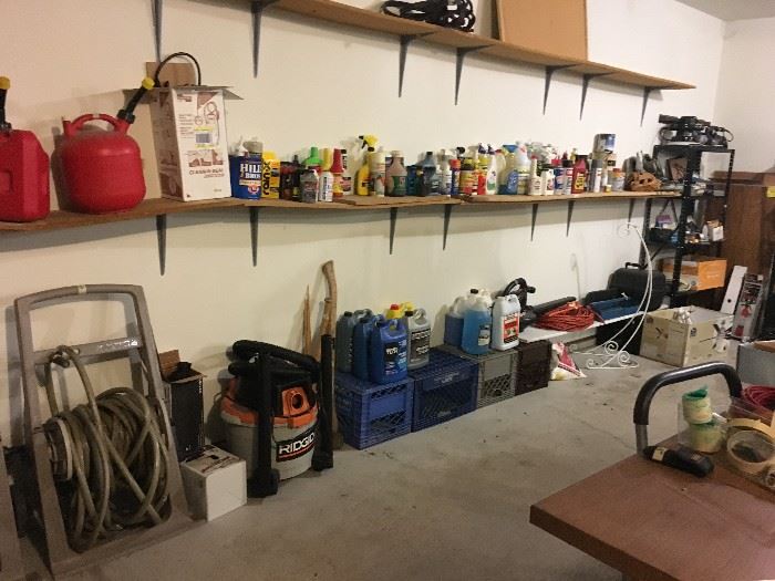 Shelves full of garage and  garden supplies!