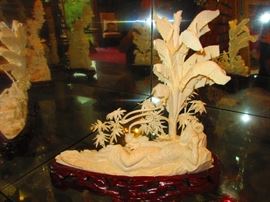 Large Carving of Quan Yin Under Palm Tree