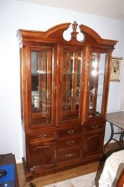 Cherry Wood Lighted China Cabinet with Beveled Glass.