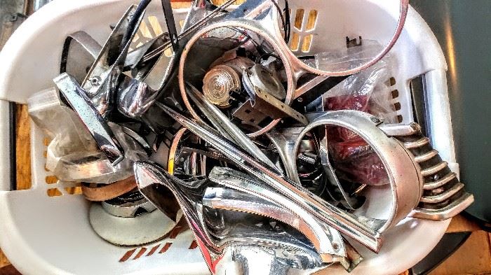 Variety of vintage chrome car parts, mirrors, headlight frames and more