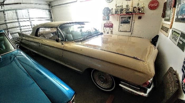 1961 Cadillac Convertible, butternut yellow with white interior/top, original paint in good condition but not show car condition. Original miles 57,764  asking $32,000. Owned since 1986.