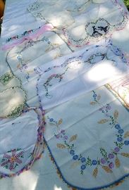 Tons of hand stitched embroidered towels, napkins, pillow covers, table clothes, etc