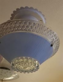 One of many hanging crystal glass ceiling lamps