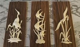 Ivory seascape art on teak
