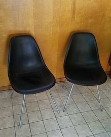 pair of black shell chairs on Eames H bases