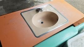 amazing peach bathroom sink with original formica countertop and faucet