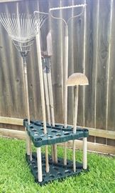 assortment of hand tools and Tupperware storage rack