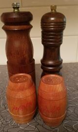 assortment of salt and pepper shakers and grinders