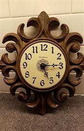 small wooden sunburst wall clock