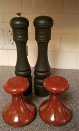assortment of salt and pepper shakers and grinders