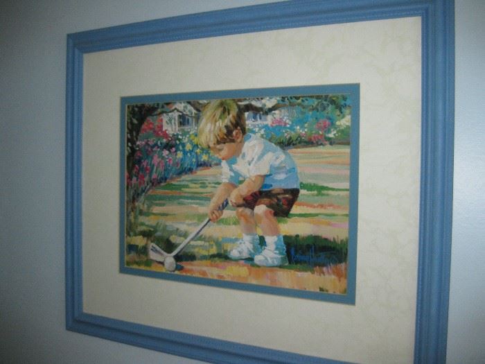 little boy golfing