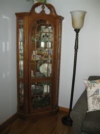 another curio cabinet loaded with collectibles