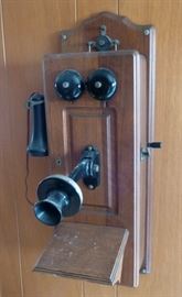 Antique telephone with inside parts (magneto) complete