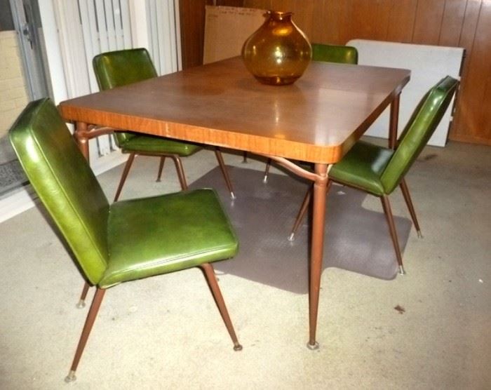 Mid-century 1950's dining table with 2 leaves and 6 chairs (two chairs not pictured), in very good condition