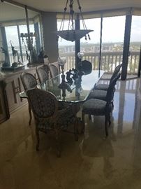 Glass top diningroom table with lion columns & 8 chairs