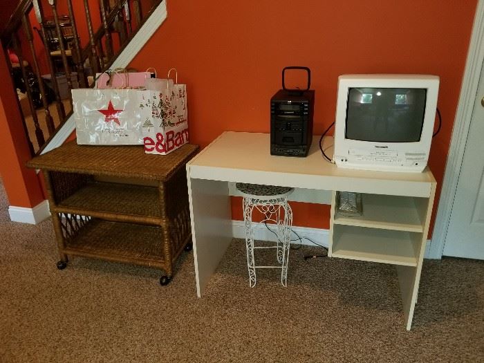 desk and wicker microwave stand