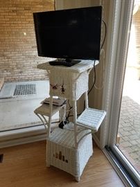 white wicker plant stand, flat screen televisions