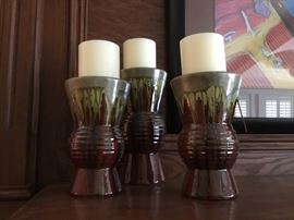 Set of three pottery candlesticks 