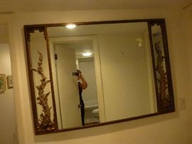 Mirror with ornate brass detail