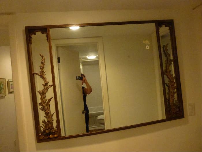 Mirror with ornate brass detail