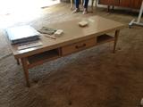 Matching blonde coffee table.