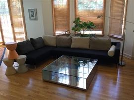 Original Terence Conran couch (70"W x 121"D), Artmide floor lamp, LITT Coffee table with transparent glass (measures 43.25"x43.25")