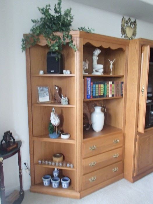 wall unit with collectibles including Rosenthal nudes
