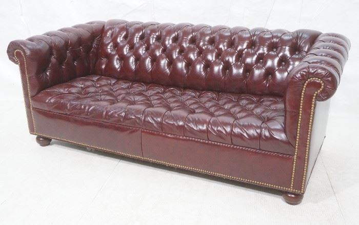 Lot 404 Burgundy Leather Chesterfield Couch. Brass tack t