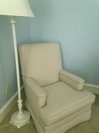 White floor lamp and comfortable chair