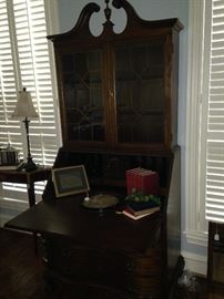 There is storage below and display above in this beautiful secretary.