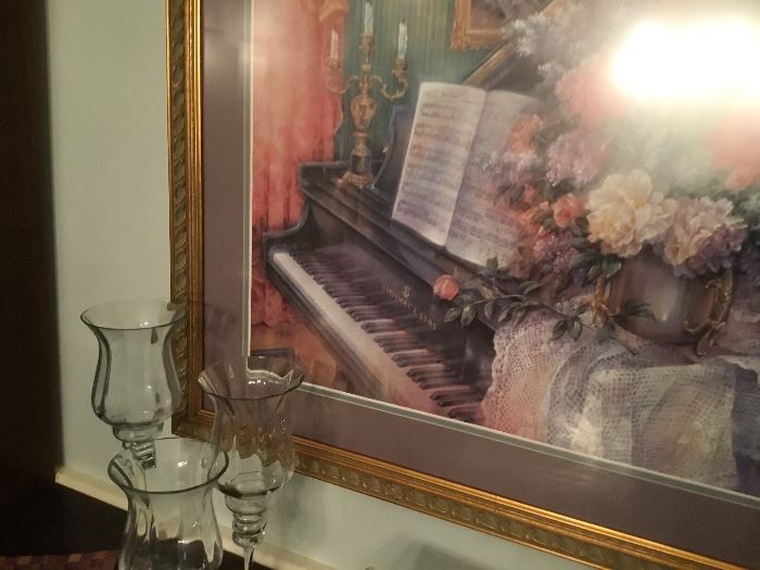 Vintage piano print and glass candlesticks.