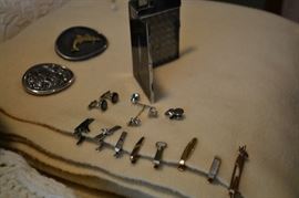 Tie bars, cufflinks, belt buckles, cigarette case.