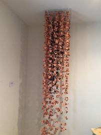 Chains of ceramic pieces that go ceiling to the floor....Stunning.....