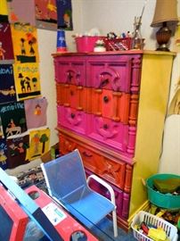 Brightly painted old chest of drawers.