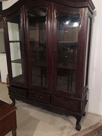 Antique style china cabinet with footed legs 