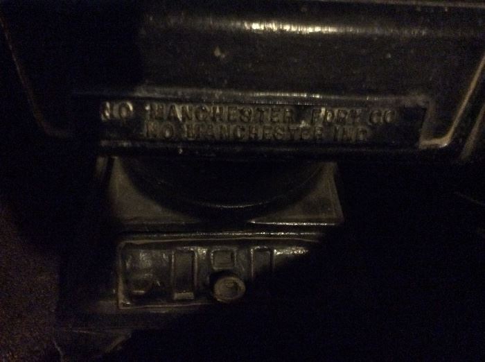 Hard to see but it is antique cast iron wood stove in pristine condition By MANCHESTER