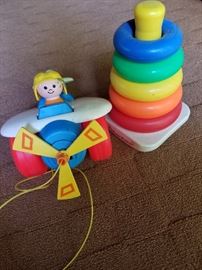Fisher Price toys. Pull behind airplane (1980) and rings.https://ctbids.com/#!/description/share/31919