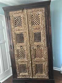 Amazing Carved Doors Tall Storage Unit