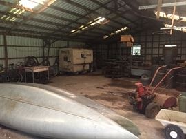 Canoes same as previous picture
Large Rototiller $75