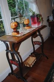 Wonderful table made from old sewing machine base, handmade wood lanterns and oil lamp