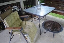 table - has 4 chairs and umbrella
