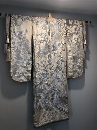 Silver thread on white background Asian robe on a rod for wall hanging