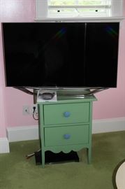 @ Drawer Cabinet in Green & Blue with Flat Screen TV