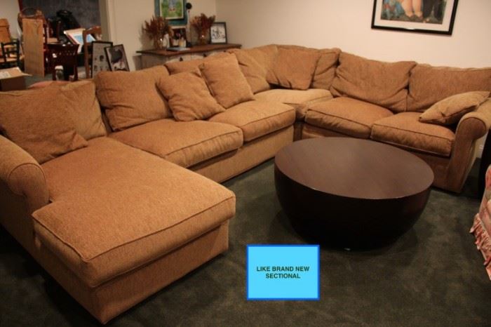Sectional in Brand New Condition and Round Coffee Table